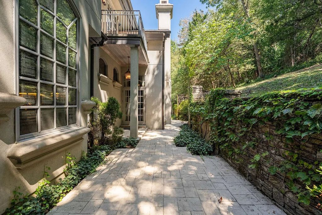 The Home in Nashville provides extensive landscaping throughout the property with dogwoods, hydrangeas and a meandering creek, now available for sale. This home located at 1310 Chickering Rd, Nashville, Tennessee