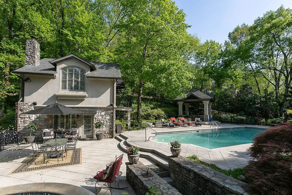 The Home in Nashville provides extensive landscaping throughout the property with dogwoods, hydrangeas and a meandering creek, now available for sale. This home located at 1310 Chickering Rd, Nashville, Tennessee