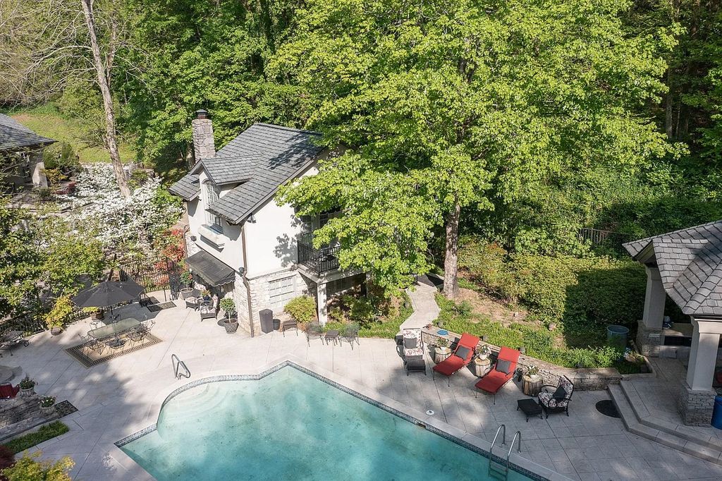 The Home in Nashville provides extensive landscaping throughout the property with dogwoods, hydrangeas and a meandering creek, now available for sale. This home located at 1310 Chickering Rd, Nashville, Tennessee