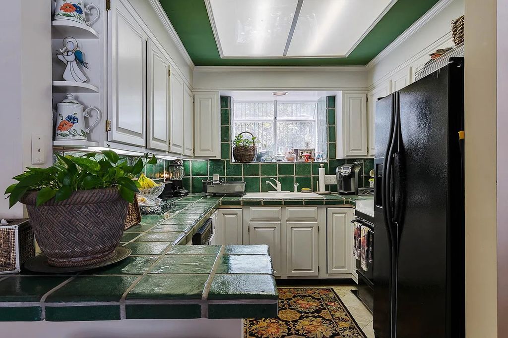 The Home in Nashville provides extensive landscaping throughout the property with dogwoods, hydrangeas and a meandering creek, now available for sale. This home located at 1310 Chickering Rd, Nashville, Tennessee