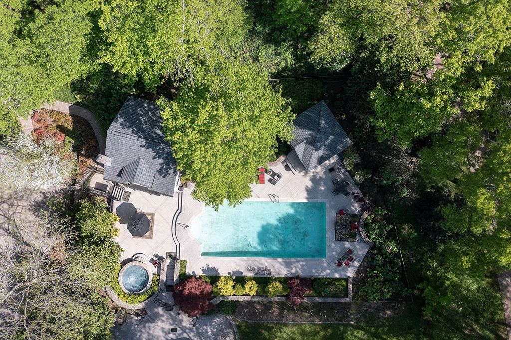 The Home in Nashville provides extensive landscaping throughout the property with dogwoods, hydrangeas and a meandering creek, now available for sale. This home located at 1310 Chickering Rd, Nashville, Tennessee