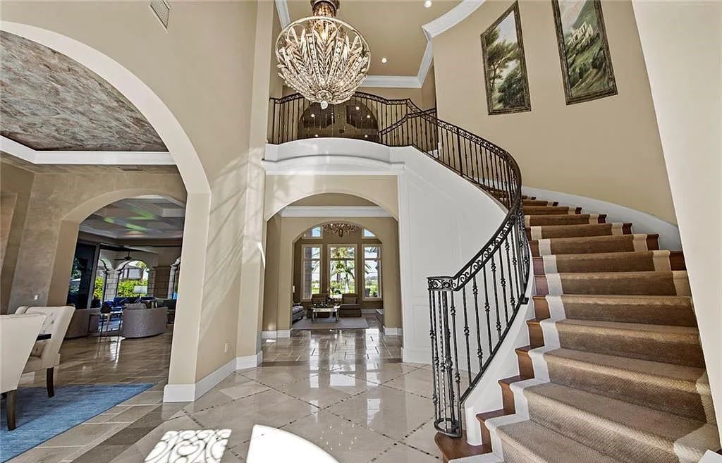 6097 Sunnyslope Drive, Naples, Florida, built by Michelangelo Builders, earning “The Best of Custom Wood, National Dream Home” & 4 Aurora awards. The spectacularly designed 2-story grand estate in Quail West is decorated with exquisite, one-of-a-kind milled woodwork.