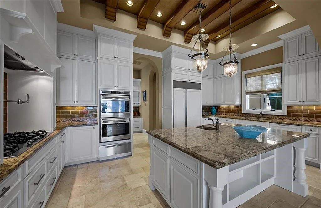 6097 Sunnyslope Drive, Naples, Florida, built by Michelangelo Builders, earning “The Best of Custom Wood, National Dream Home” & 4 Aurora awards. The spectacularly designed 2-story grand estate in Quail West is decorated with exquisite, one-of-a-kind milled woodwork.