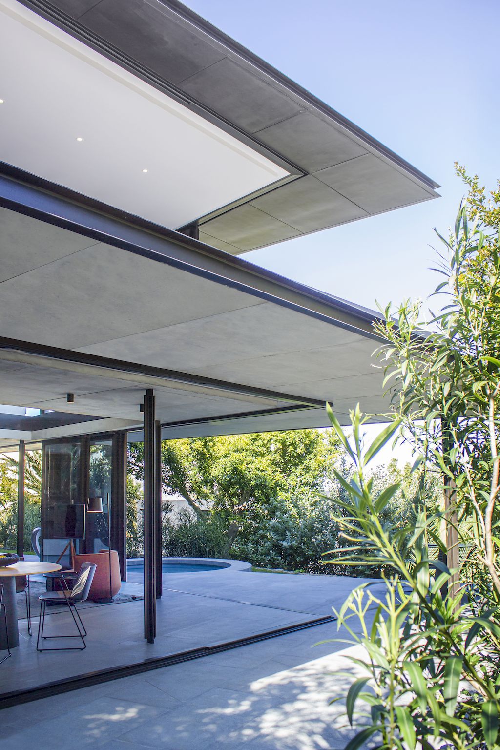 Cranberry Pavilion House prominent with its dark color by Wright Architects