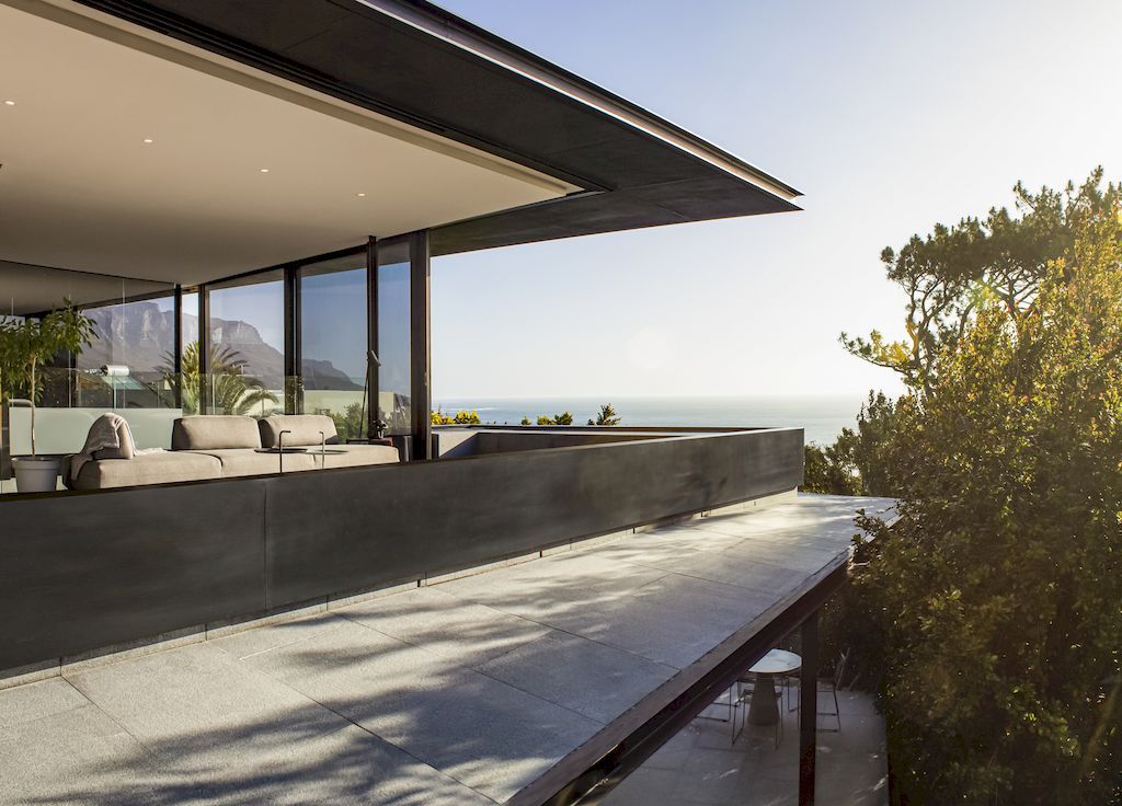 Cranberry Pavilion House prominent with its dark color by Wright Architects