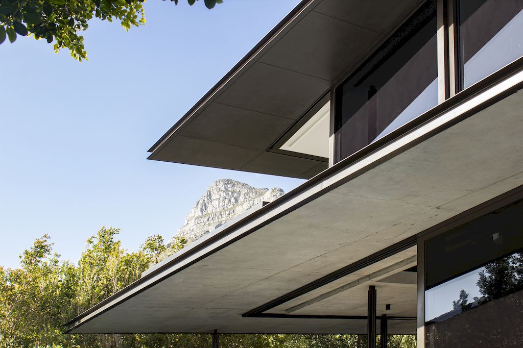 Cranberry Pavilion House prominent with its dark color by Wright Architects