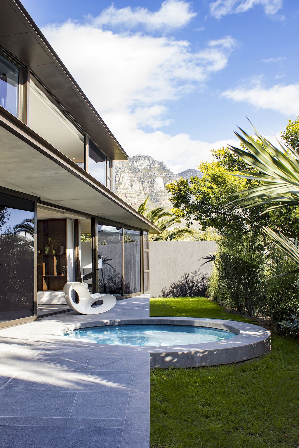 Cranberry Pavilion House prominent with its dark color by Wright Architects