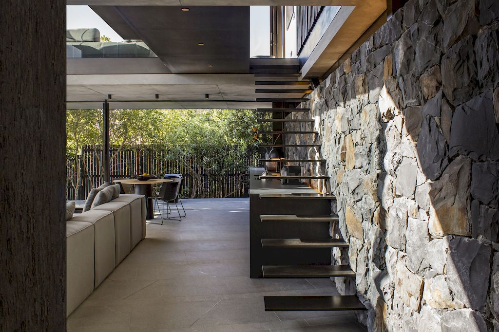 Cranberry Pavilion House prominent with its dark color by Wright Architects