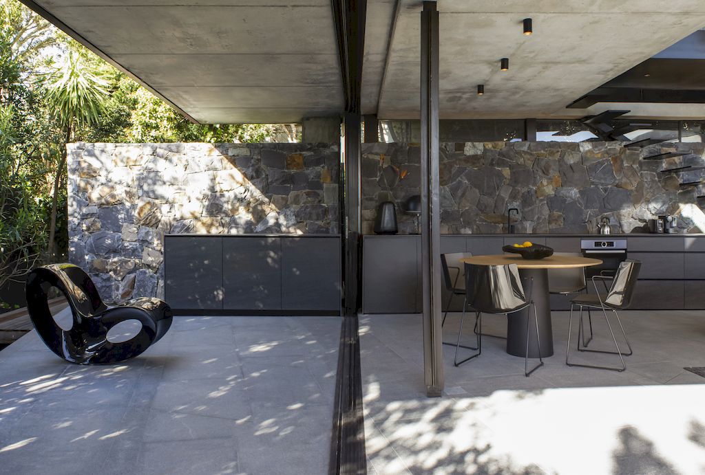Cranberry Pavilion House prominent with its dark color by Wright Architects