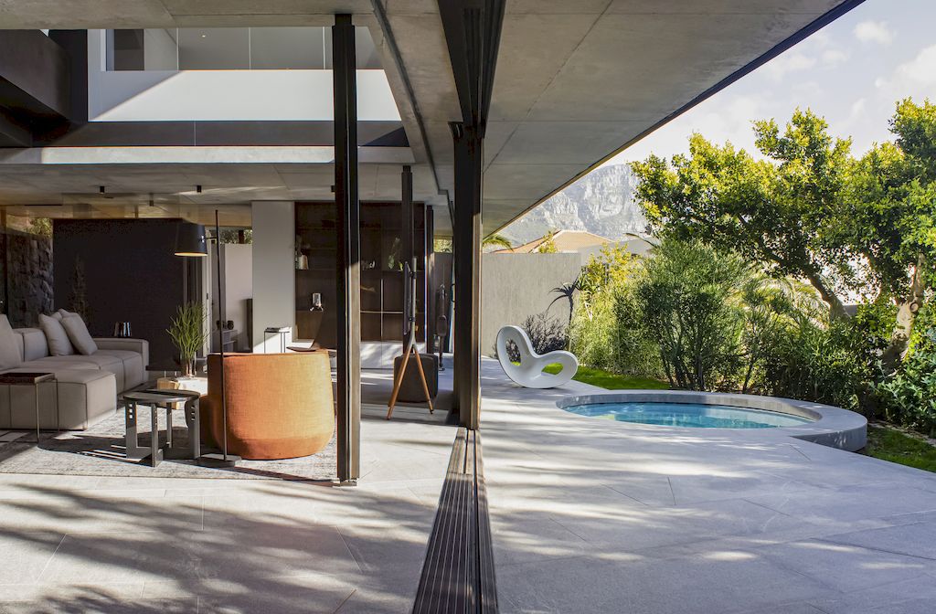Cranberry Pavilion House prominent with its dark color by Wright Architects
