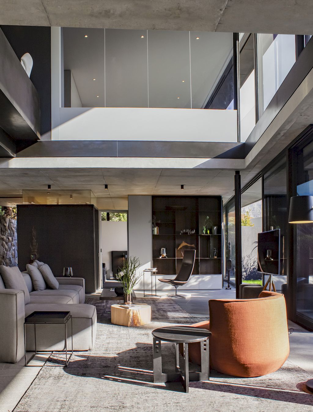 Cranberry Pavilion House prominent with its dark color by Wright Architects