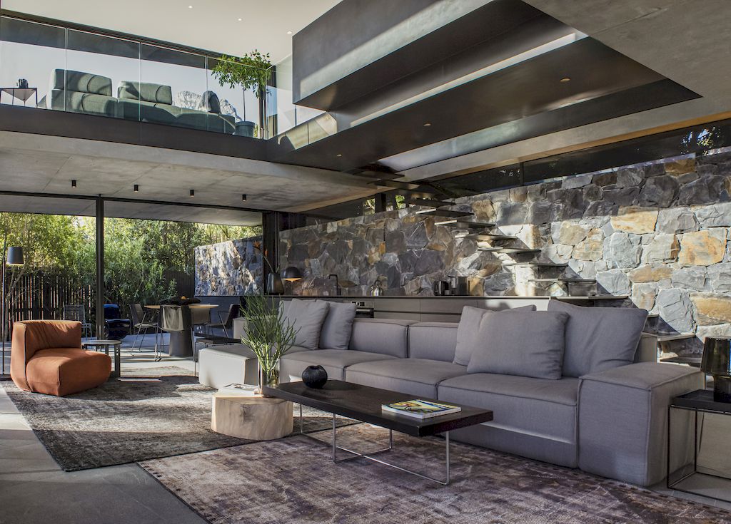 Cranberry Pavilion House prominent with its dark color by Wright Architects