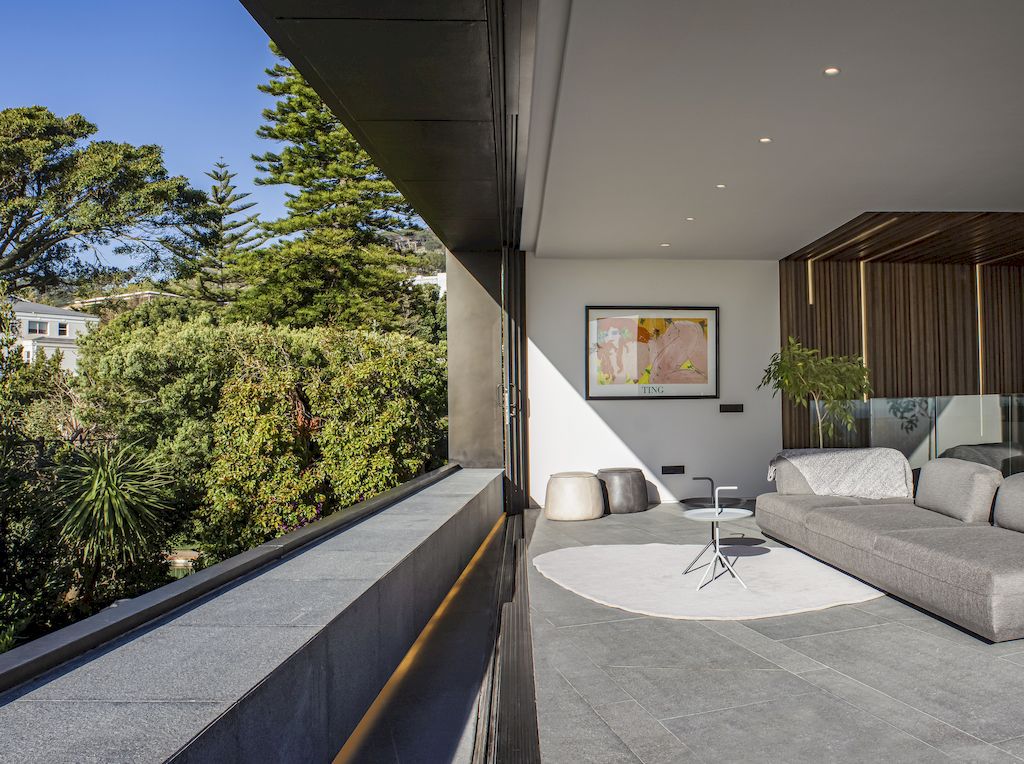 Cranberry Pavilion House prominent with its dark color by Wright Architects