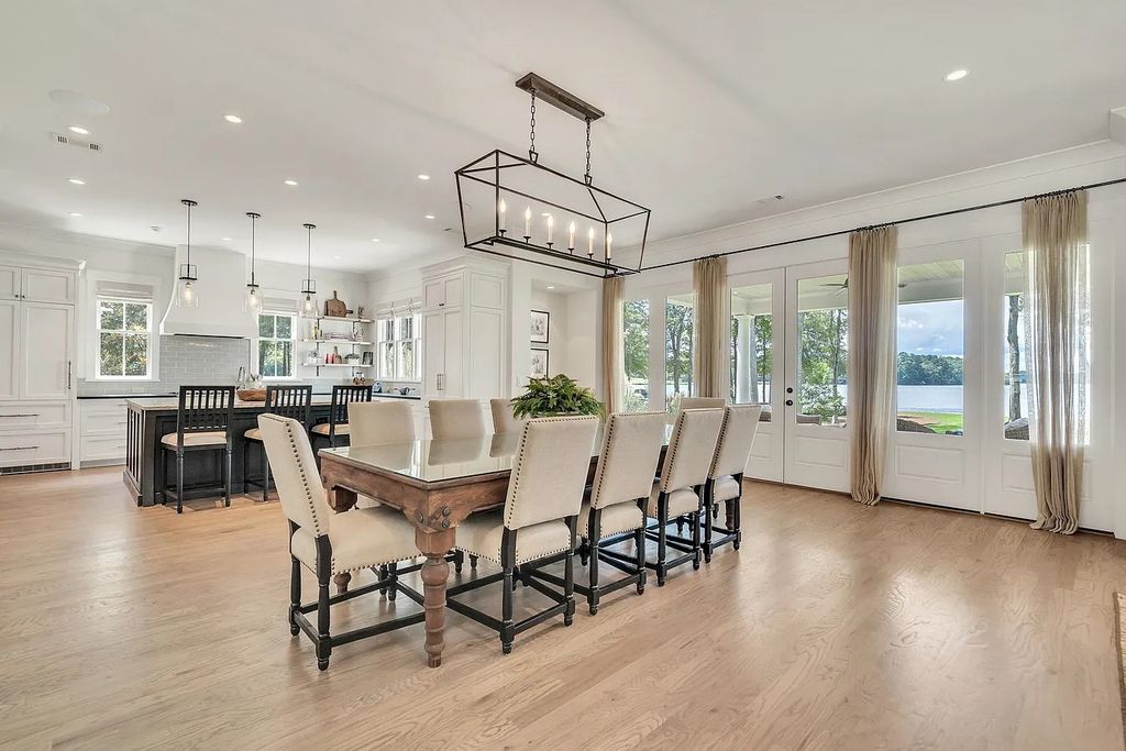 The House in Eatonton boasts gorgeous landscaping and 180 degree views of Lake Oconee, now available for sale. This home located at 158 Bradford Dr, Eatonton, Georgia