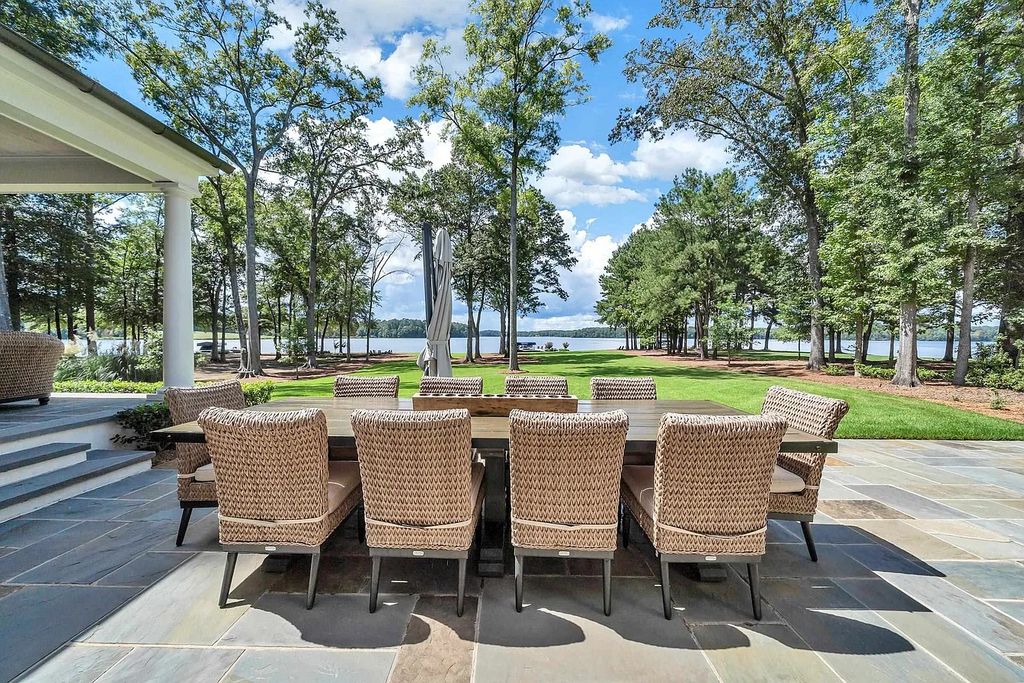 The House in Eatonton boasts gorgeous landscaping and 180 degree views of Lake Oconee, now available for sale. This home located at 158 Bradford Dr, Eatonton, Georgia
