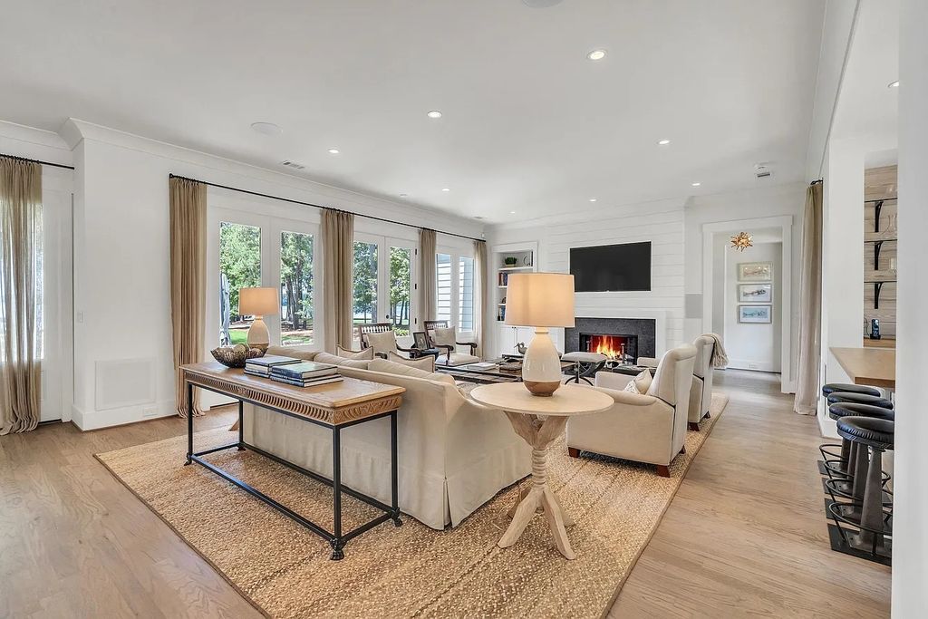 The House in Eatonton boasts gorgeous landscaping and 180 degree views of Lake Oconee, now available for sale. This home located at 158 Bradford Dr, Eatonton, Georgia