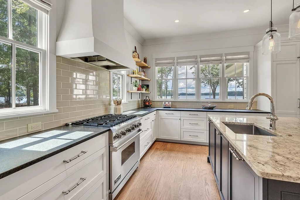The House in Eatonton boasts gorgeous landscaping and 180 degree views of Lake Oconee, now available for sale. This home located at 158 Bradford Dr, Eatonton, Georgia