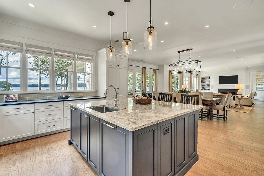 The House in Eatonton boasts gorgeous landscaping and 180 degree views of Lake Oconee, now available for sale. This home located at 158 Bradford Dr, Eatonton, Georgia