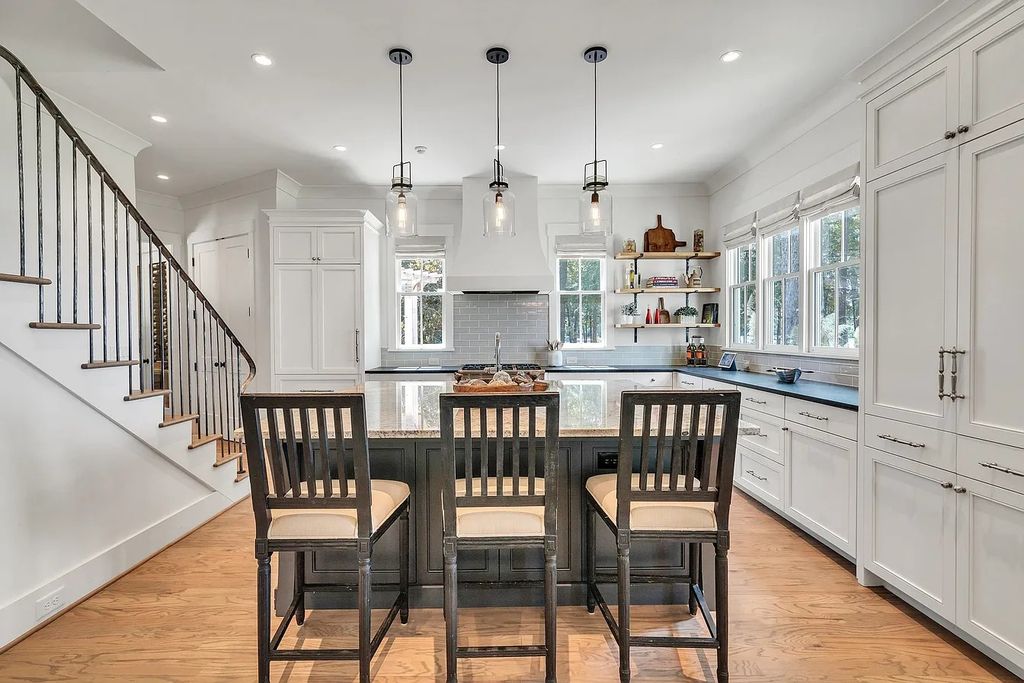 The House in Eatonton boasts gorgeous landscaping and 180 degree views of Lake Oconee, now available for sale. This home located at 158 Bradford Dr, Eatonton, Georgia