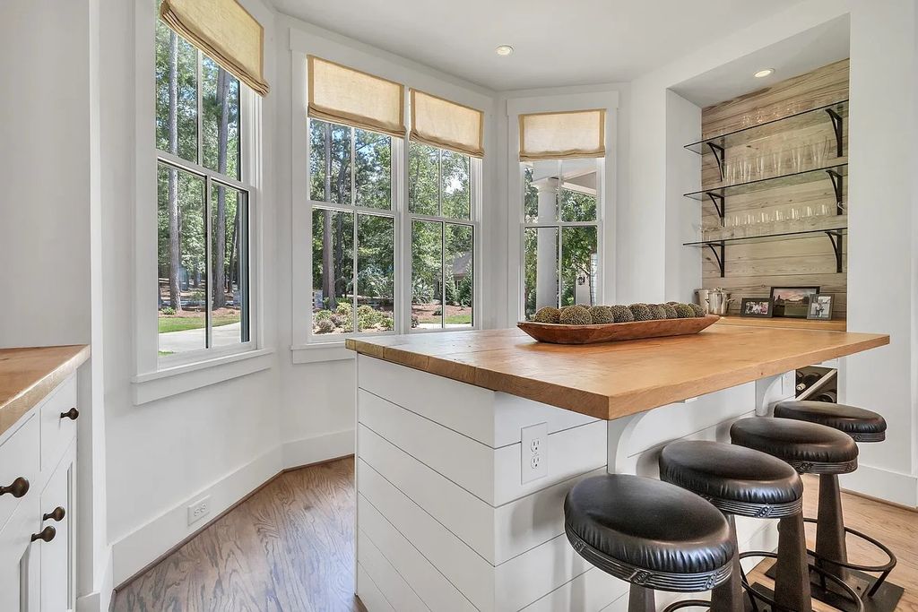 The House in Eatonton boasts gorgeous landscaping and 180 degree views of Lake Oconee, now available for sale. This home located at 158 Bradford Dr, Eatonton, Georgia