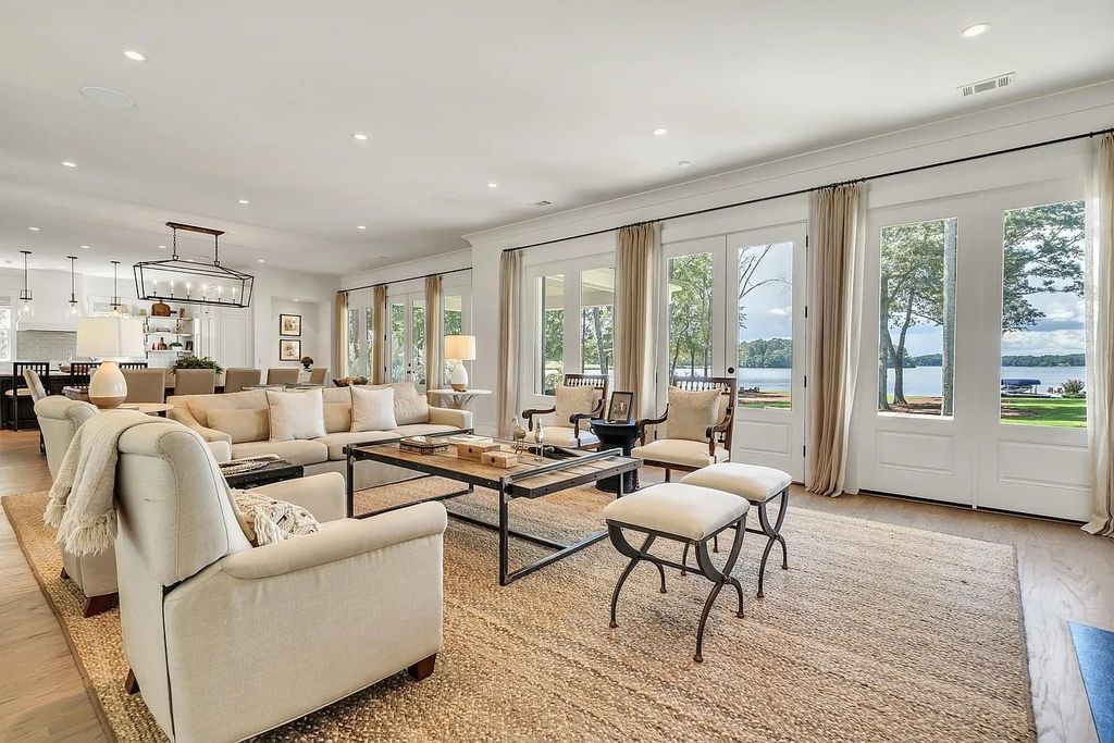 The House in Eatonton boasts gorgeous landscaping and 180 degree views of Lake Oconee, now available for sale. This home located at 158 Bradford Dr, Eatonton, Georgia