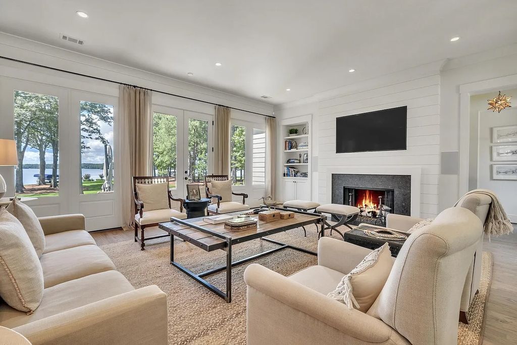 The House in Eatonton boasts gorgeous landscaping and 180 degree views of Lake Oconee, now available for sale. This home located at 158 Bradford Dr, Eatonton, Georgia