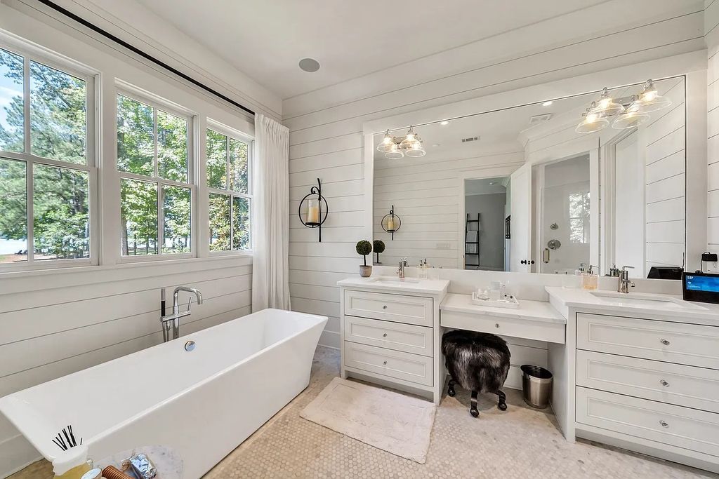 The House in Eatonton boasts gorgeous landscaping and 180 degree views of Lake Oconee, now available for sale. This home located at 158 Bradford Dr, Eatonton, Georgia