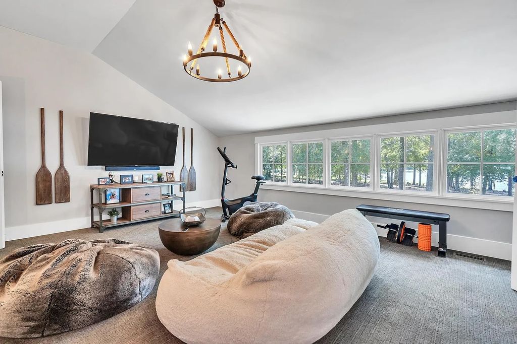The House in Eatonton boasts gorgeous landscaping and 180 degree views of Lake Oconee, now available for sale. This home located at 158 Bradford Dr, Eatonton, Georgia