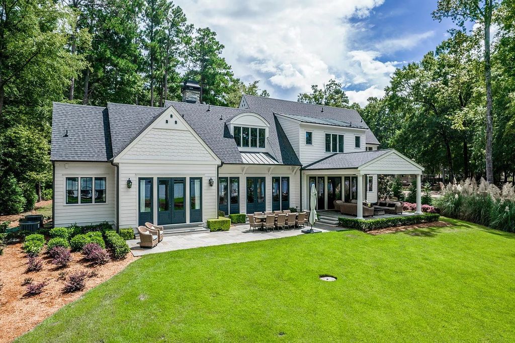 The House in Eatonton boasts gorgeous landscaping and 180 degree views of Lake Oconee, now available for sale. This home located at 158 Bradford Dr, Eatonton, Georgia