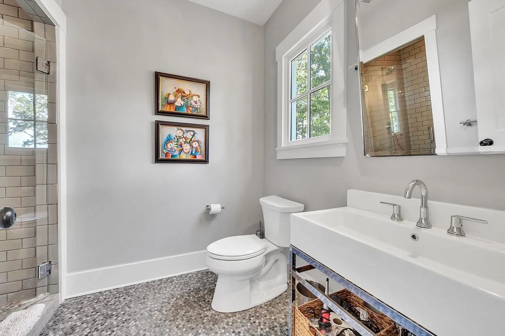 The House in Eatonton boasts gorgeous landscaping and 180 degree views of Lake Oconee, now available for sale. This home located at 158 Bradford Dr, Eatonton, Georgia