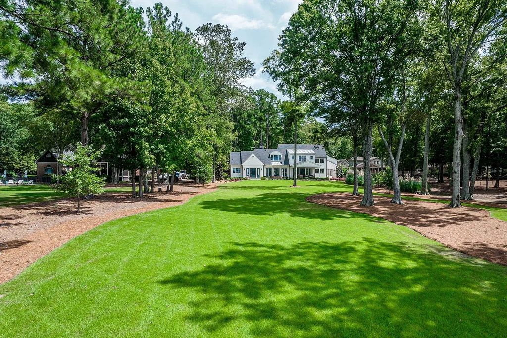 The House in Eatonton boasts gorgeous landscaping and 180 degree views of Lake Oconee, now available for sale. This home located at 158 Bradford Dr, Eatonton, Georgia