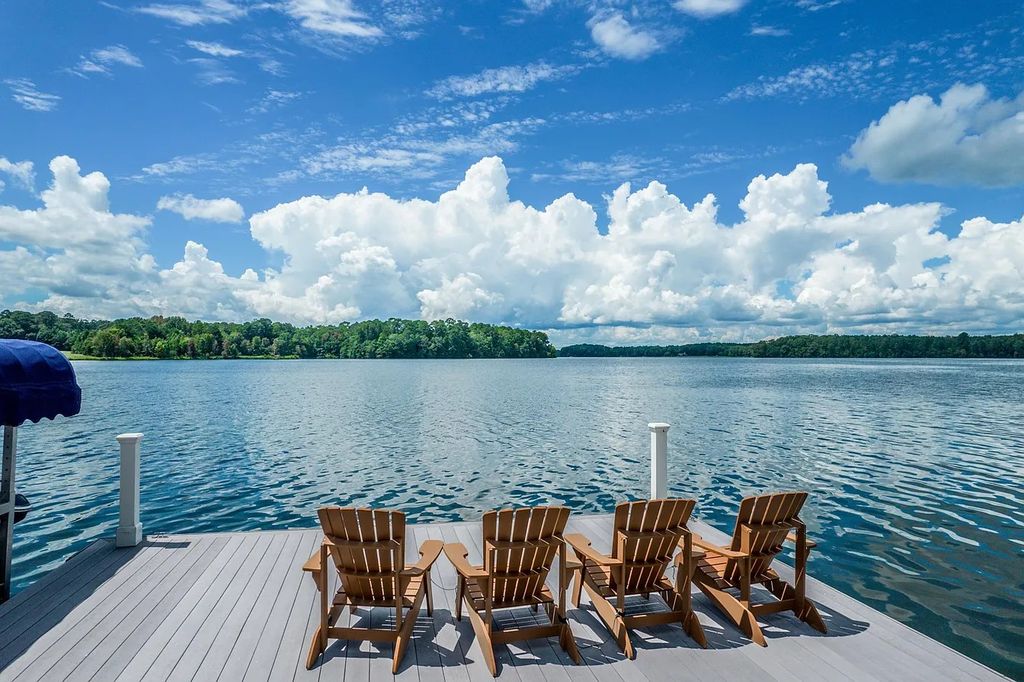 The House in Eatonton boasts gorgeous landscaping and 180 degree views of Lake Oconee, now available for sale. This home located at 158 Bradford Dr, Eatonton, Georgia