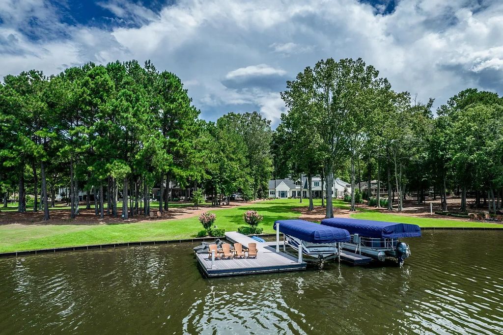 The House in Eatonton boasts gorgeous landscaping and 180 degree views of Lake Oconee, now available for sale. This home located at 158 Bradford Dr, Eatonton, Georgia