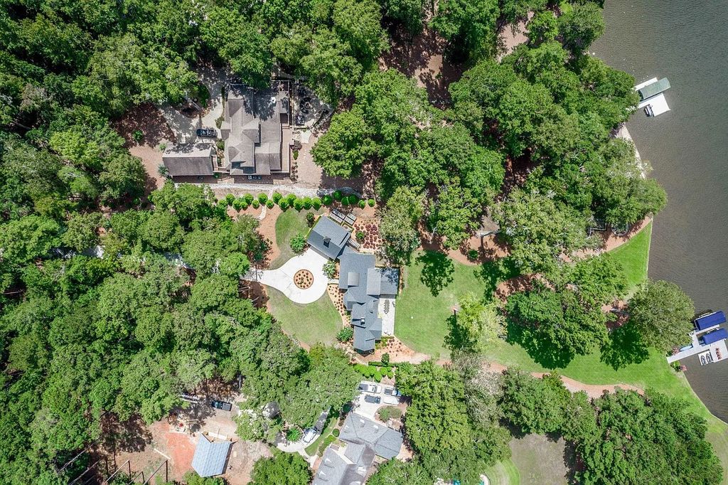 The House in Eatonton boasts gorgeous landscaping and 180 degree views of Lake Oconee, now available for sale. This home located at 158 Bradford Dr, Eatonton, Georgia