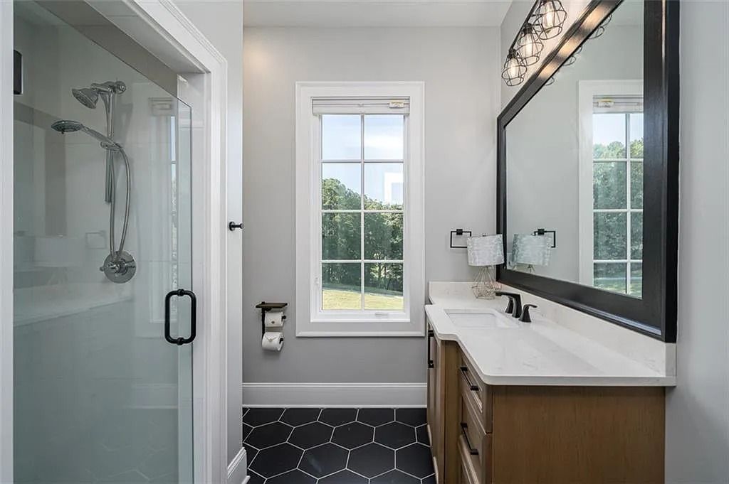 The House in Canton includes a Barndominium guest house, multiple creeks and fenced pastures perfect for horses, now available for sale. This home located at 1661 Harmony Dr, Canton, Georgia