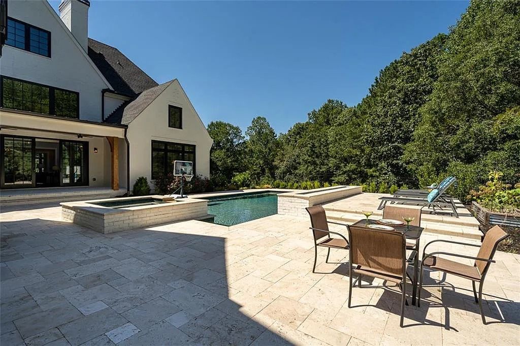 The House in Canton includes a Barndominium guest house, multiple creeks and fenced pastures perfect for horses, now available for sale. This home located at 1661 Harmony Dr, Canton, Georgia