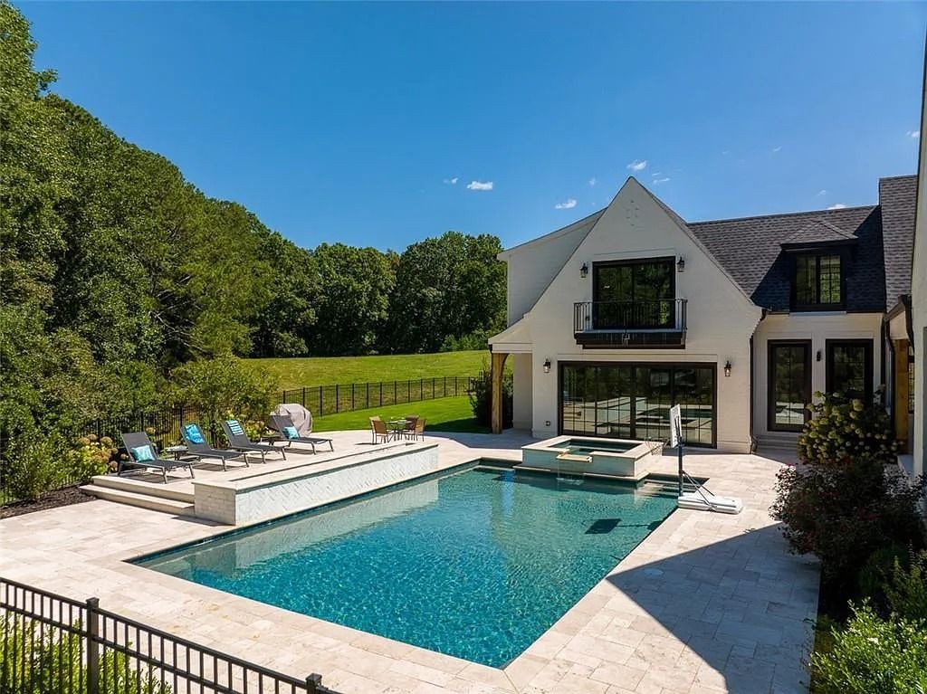 The House in Canton includes a Barndominium guest house, multiple creeks and fenced pastures perfect for horses, now available for sale. This home located at 1661 Harmony Dr, Canton, Georgia