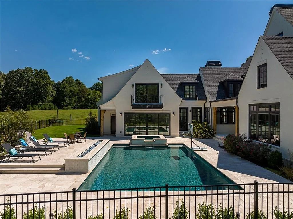 The House in Canton includes a Barndominium guest house, multiple creeks and fenced pastures perfect for horses, now available for sale. This home located at 1661 Harmony Dr, Canton, Georgia