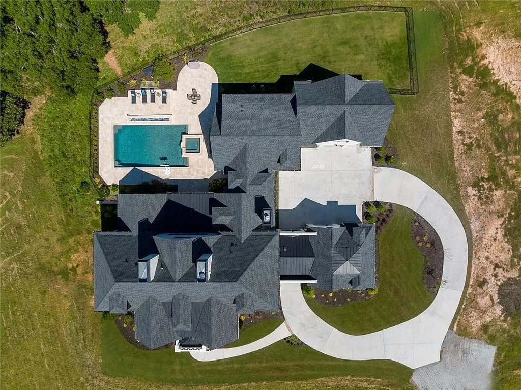 The House in Canton includes a Barndominium guest house, multiple creeks and fenced pastures perfect for horses, now available for sale. This home located at 1661 Harmony Dr, Canton, Georgia