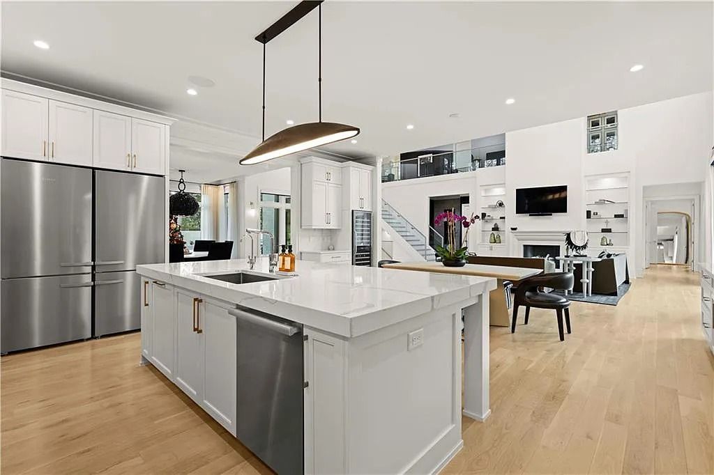 The Estate in Atlanta is a luxurious home with an open concept floor plan featuring gorgeous white oak hardwood flooring throughout, now available for sale. This home located at 1107 Moores Mill Rd NW, Atlanta, Georgia