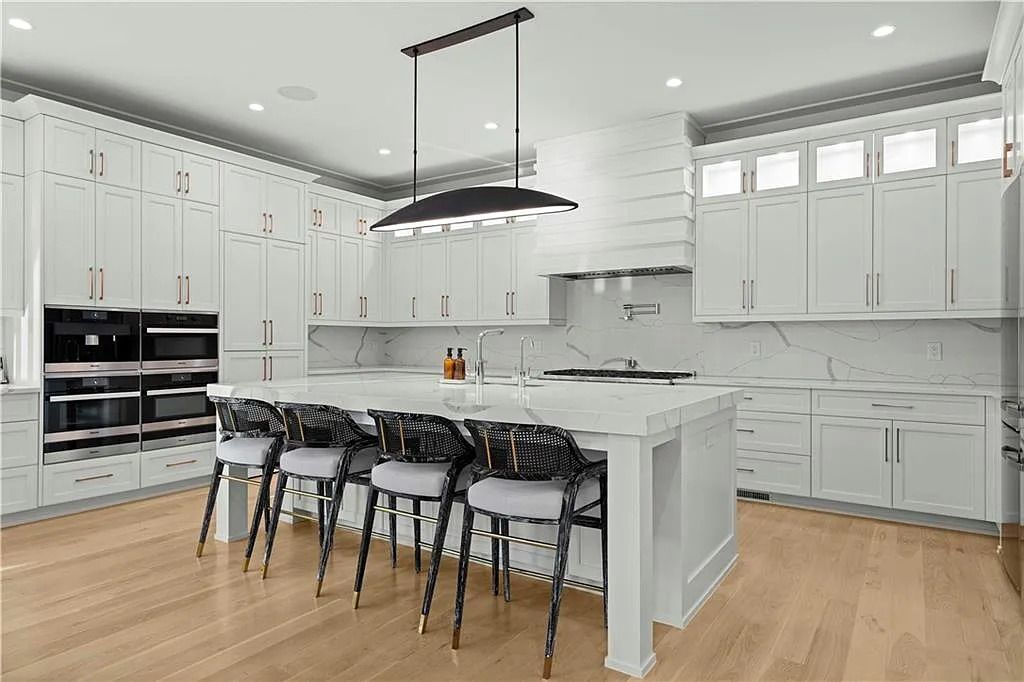 The Estate in Atlanta is a luxurious home with an open concept floor plan featuring gorgeous white oak hardwood flooring throughout, now available for sale. This home located at 1107 Moores Mill Rd NW, Atlanta, Georgia