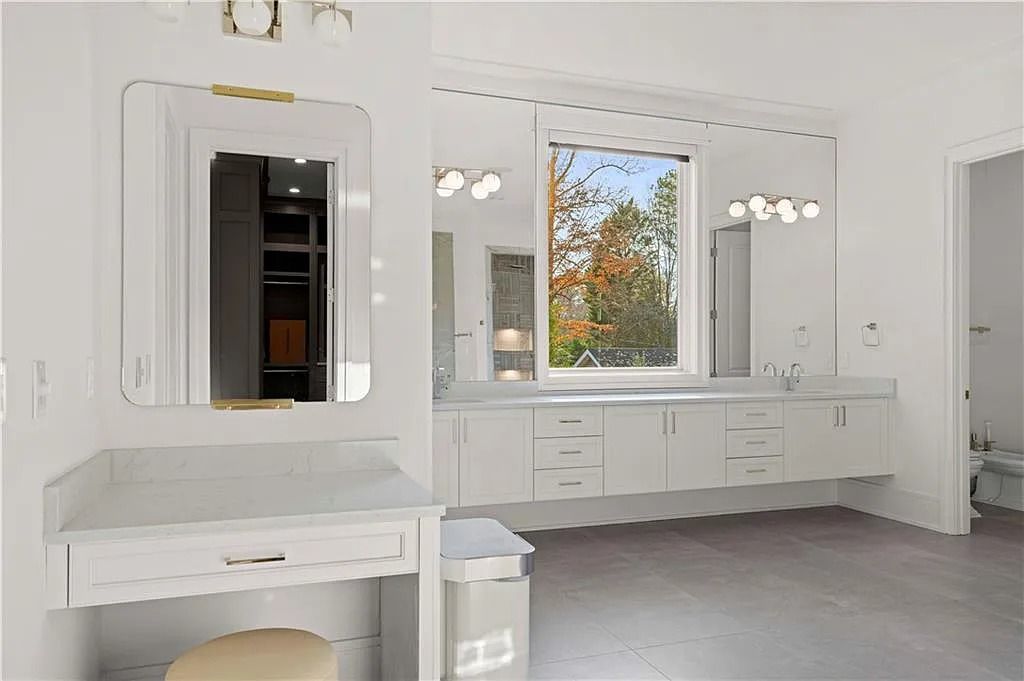 The Estate in Atlanta is a luxurious home with an open concept floor plan featuring gorgeous white oak hardwood flooring throughout, now available for sale. This home located at 1107 Moores Mill Rd NW, Atlanta, Georgia
