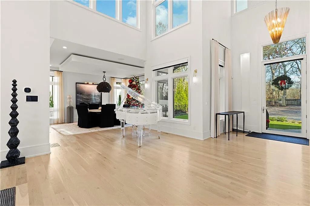 The Estate in Atlanta is a luxurious home with an open concept floor plan featuring gorgeous white oak hardwood flooring throughout, now available for sale. This home located at 1107 Moores Mill Rd NW, Atlanta, Georgia