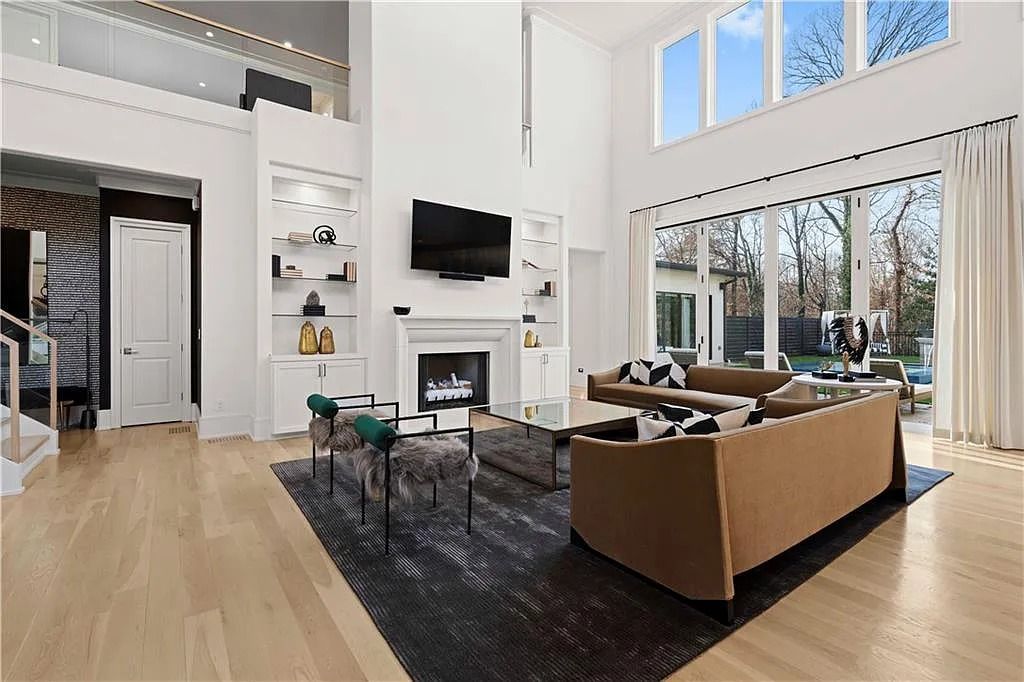 The Estate in Atlanta is a luxurious home with an open concept floor plan featuring gorgeous white oak hardwood flooring throughout, now available for sale. This home located at 1107 Moores Mill Rd NW, Atlanta, Georgia