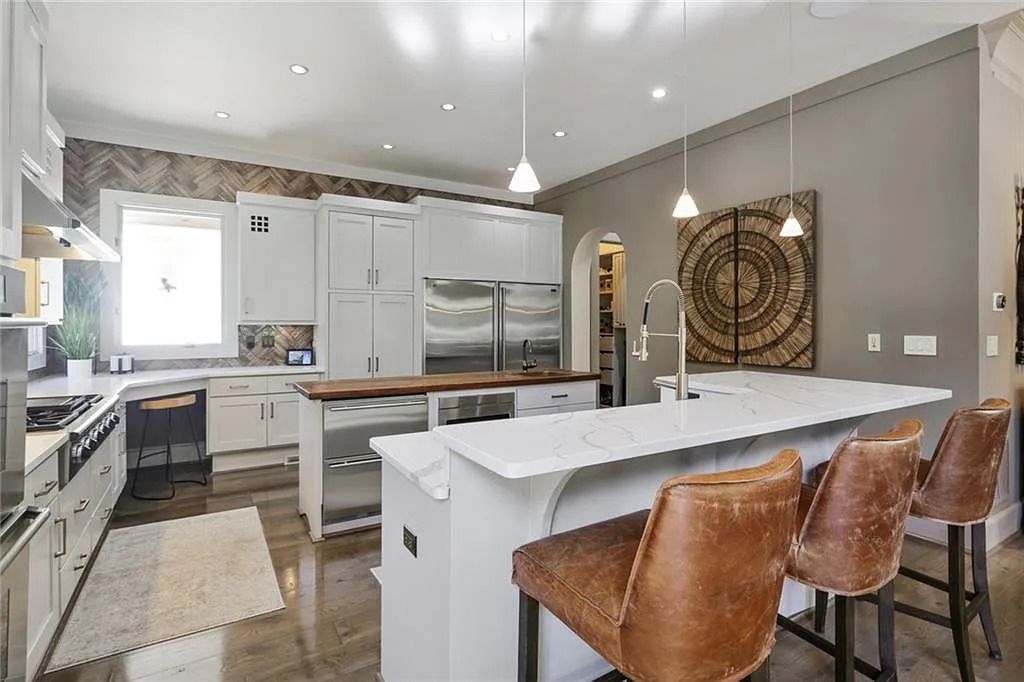 The Home in Kennesaw is the entertainers delight with large open spaces and a salt water pool with a connecting hot tub and wine cellar, now available for sale. This home located at 4235 Old Stilesboro Rd NW, Kennesaw, Georgia