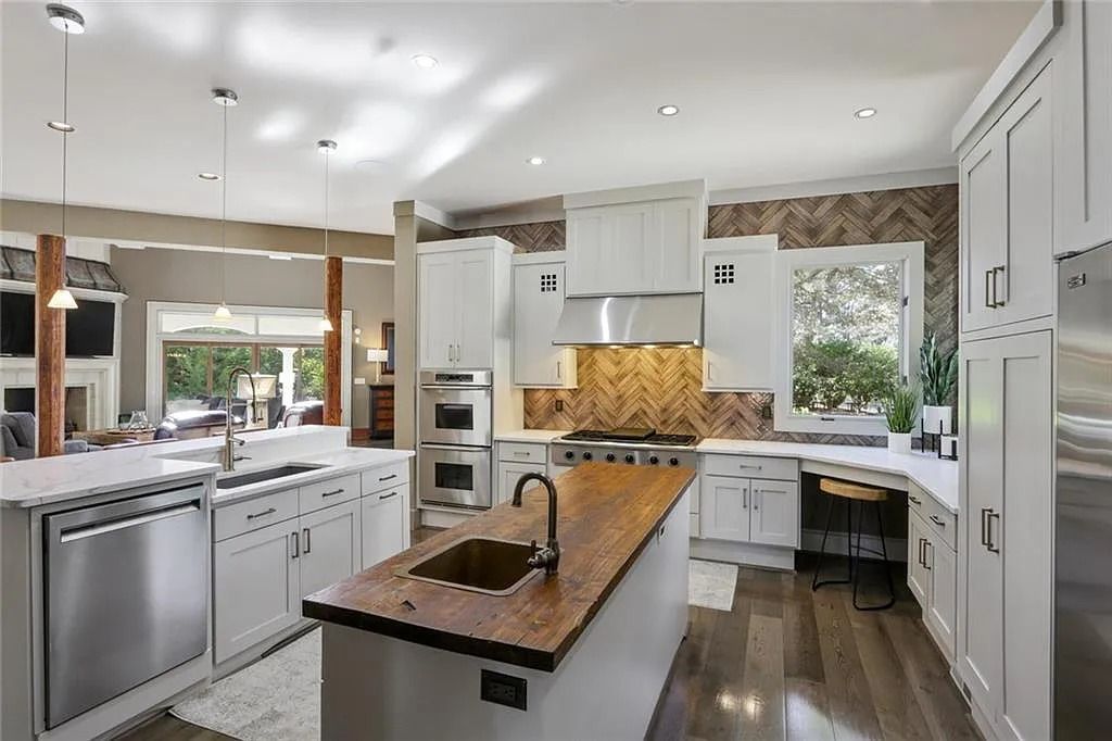 The Home in Kennesaw is the entertainers delight with large open spaces and a salt water pool with a connecting hot tub and wine cellar, now available for sale. This home located at 4235 Old Stilesboro Rd NW, Kennesaw, Georgia