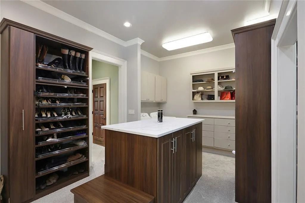 The Home in Kennesaw is the entertainers delight with large open spaces and a salt water pool with a connecting hot tub and wine cellar, now available for sale. This home located at 4235 Old Stilesboro Rd NW, Kennesaw, Georgia