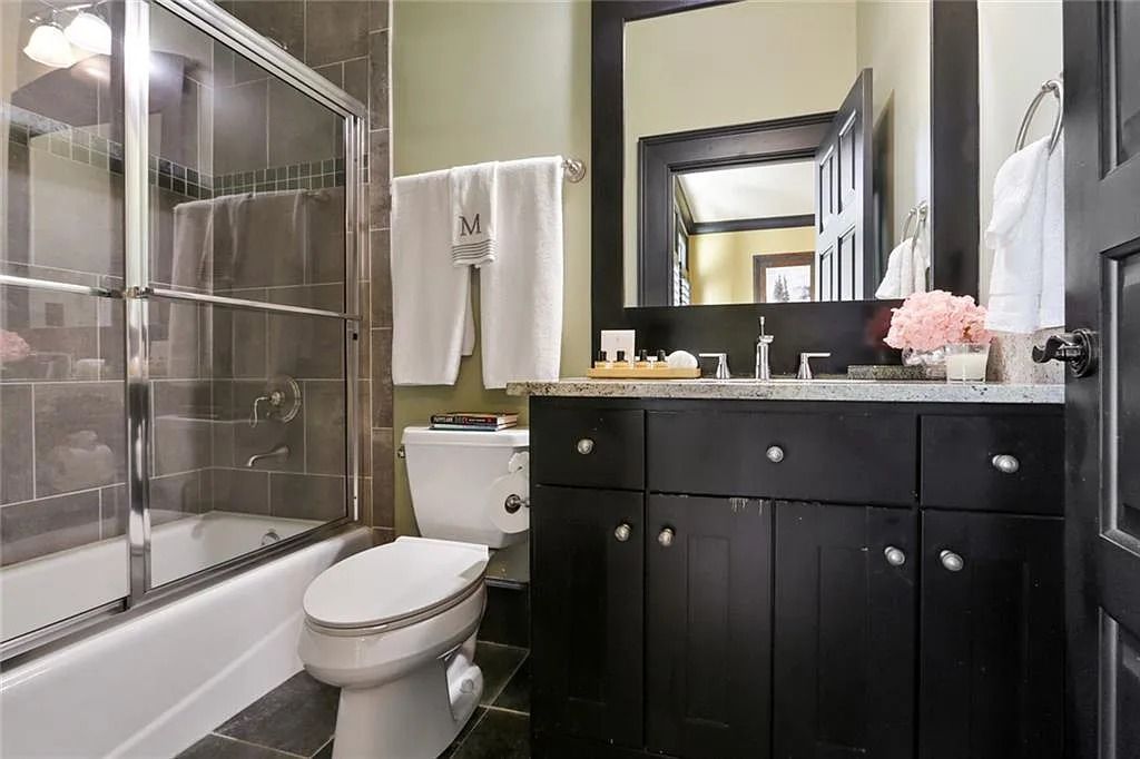 The Home in Kennesaw is the entertainers delight with large open spaces and a salt water pool with a connecting hot tub and wine cellar, now available for sale. This home located at 4235 Old Stilesboro Rd NW, Kennesaw, Georgia