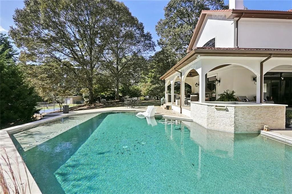The Home in Kennesaw is the entertainers delight with large open spaces and a salt water pool with a connecting hot tub and wine cellar, now available for sale. This home located at 4235 Old Stilesboro Rd NW, Kennesaw, Georgia