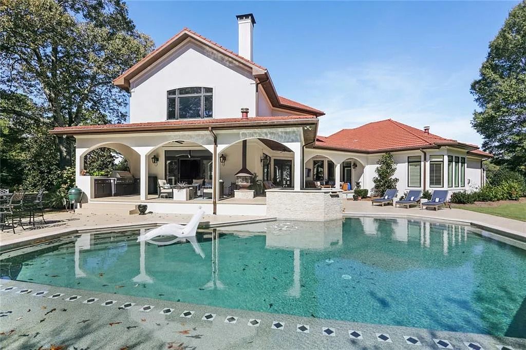 The Home in Kennesaw is the entertainers delight with large open spaces and a salt water pool with a connecting hot tub and wine cellar, now available for sale. This home located at 4235 Old Stilesboro Rd NW, Kennesaw, Georgia